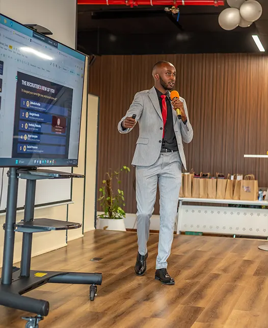 Elvis W. presenting practical digital skills to a live audience